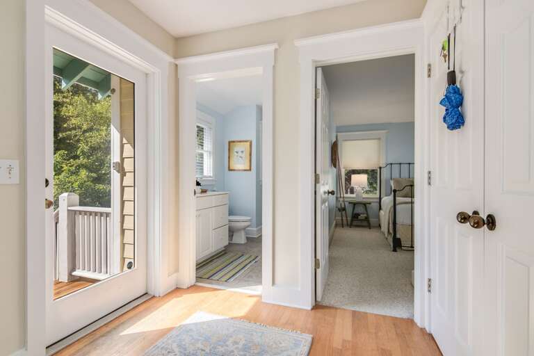 Bright, Breezy Rooms Leading Through Light Doors With A Glimpse Of Green Garden