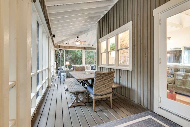 Bright Balcony Bordered By Big Windows, Wooden Floor, Woven Chair, White Walls