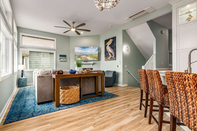 Light-filled Living Space With Sea Shades And Sleek Surfaces