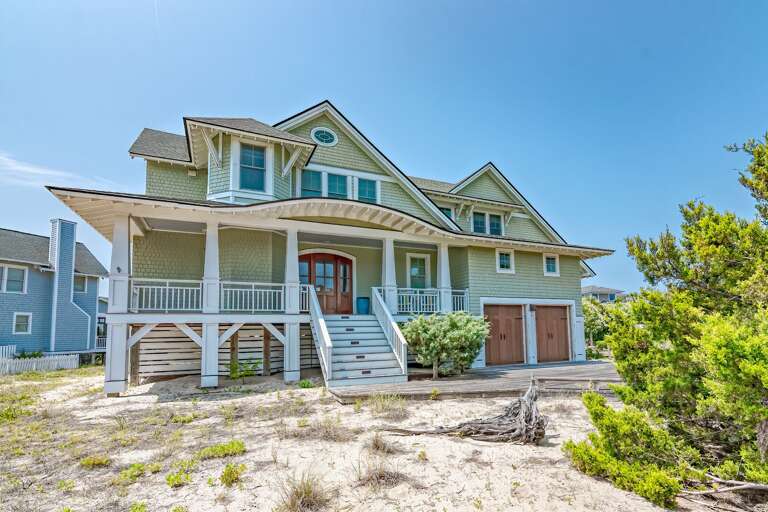 Beachfront Building With Balcony, Blue Sky Backdrop Beachfront Building With Balcony, Blue Sky Backdrop