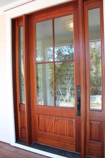 Sturdy Wooden Door With Glass Panes And Sidelights