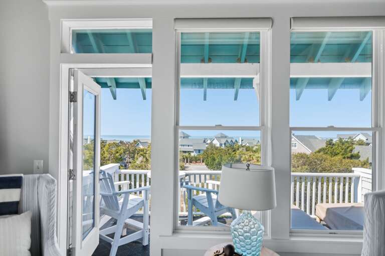 Balcony View With Blue Skies And Ocean In Distance