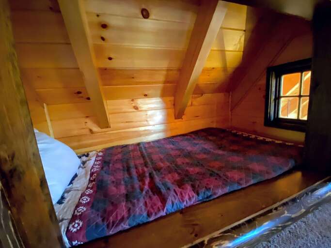 Close up of one of the two twin cubby beds