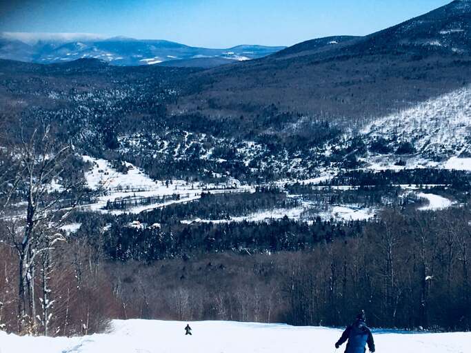 View from the ski slopes; the cabin is in the foreground, right in front of the slopes