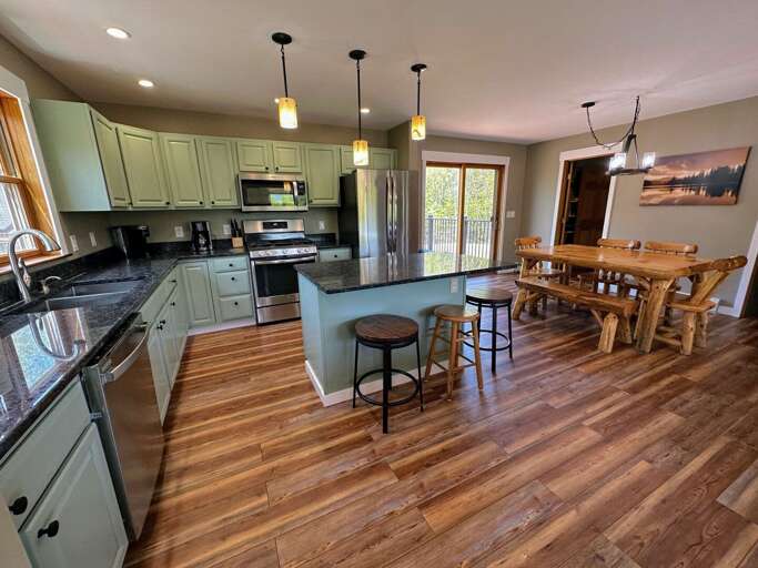 The top floor kitchen has modern appliances, and everything you may need to make a home cooked meal! An additional kitchen on the lower level provides added flexibility.