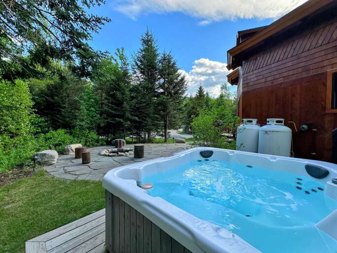 Outdoor Hot Tub With Garden And Trees