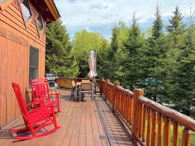 Main deck with patio table and propane grill