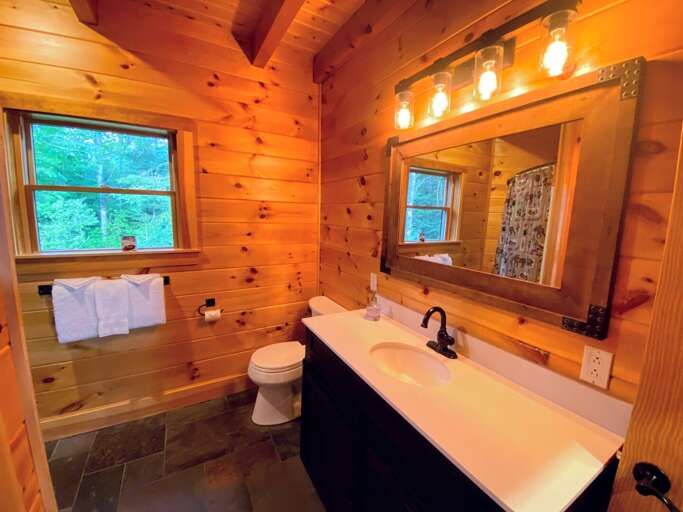 Main level shared full bath with shower/tub combo Main level shared full bath with shower/tub combo