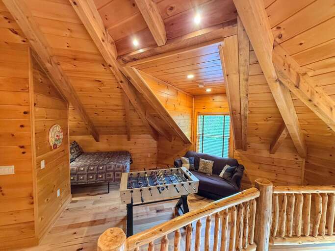 Upstairs loft with foosball, full bed and ring toss!