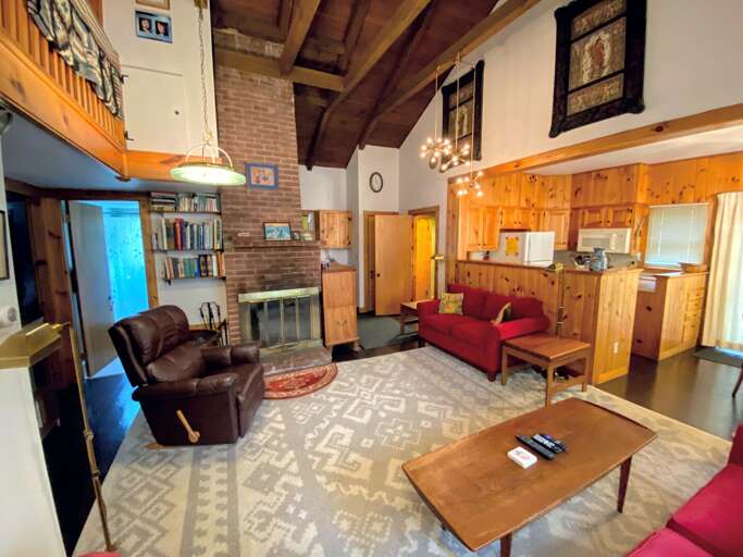 View of the living room, kitchen, and bathroom #2.