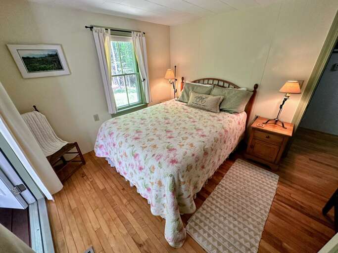 Queen bedroom with walkout to porch