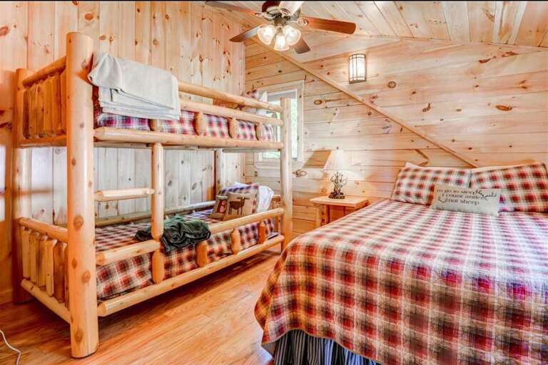 Guest Bedroom #2 is located on the second floor and features a Queen and 2 Twin beds. Sleeps 4.