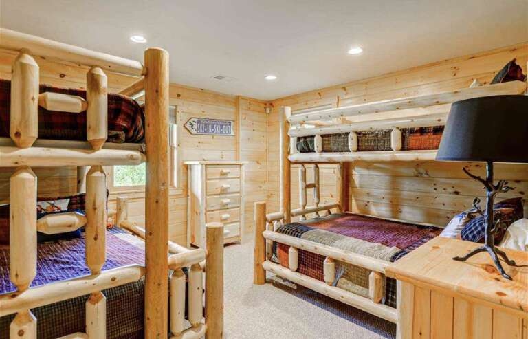 Guest Bedroom #4 is located on the lower level and features 2 Twin/Full bunk beds. Sleeps 6.
