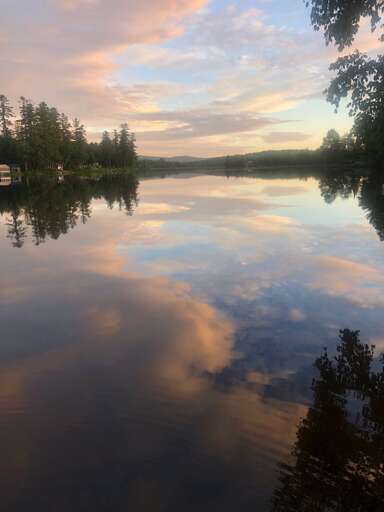 Lake At Sunset With Reflection Of Clouds