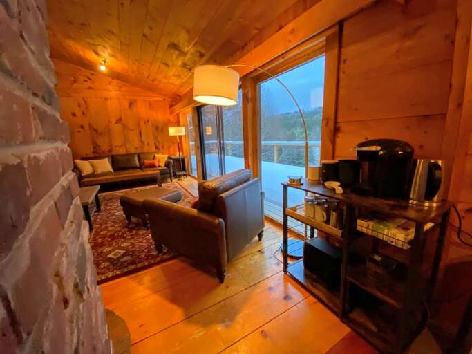 Coffee bar next to dining table and living room on the main level