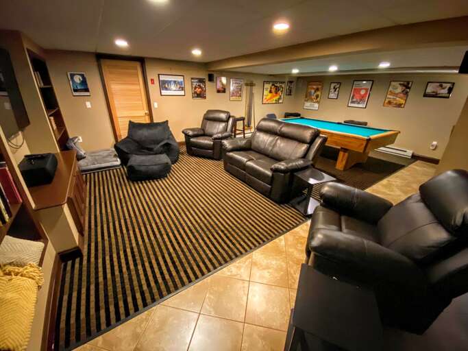Lower level theater room, pool room and kitchenette