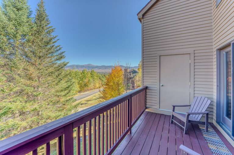 Enjoy the main level walkout deck with Mount Washington views