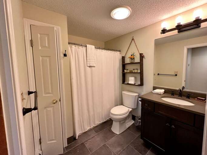 Lower level shared bath with shower/tub combo Lower level shared bath with shower/tub combo