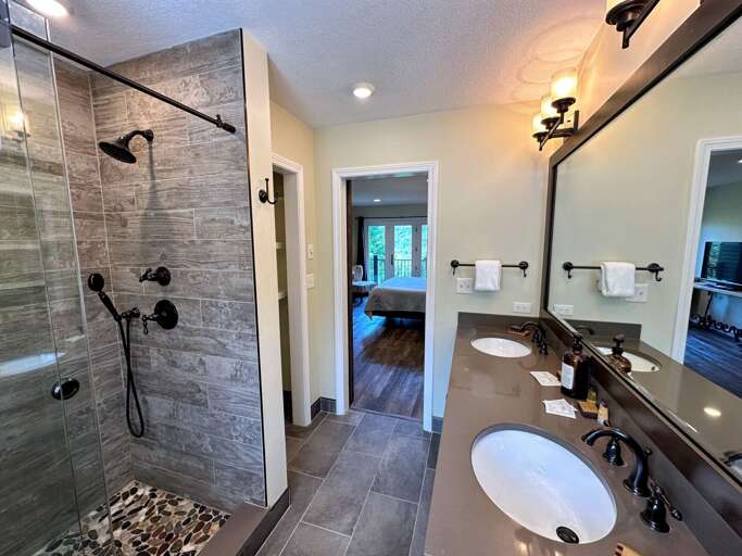 Main level King bedroom private bath with shower Main level King bedroom private bath with shower