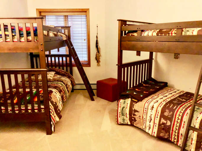 Guest Bedroom #4 is located on the lower level and features 2 Twin/Twin bunk bed. Sleeps 4.