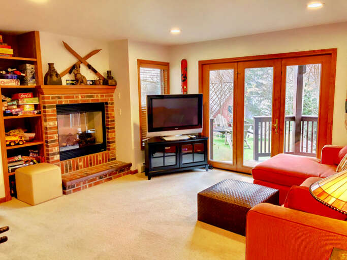 Lower Level Area has the second living and game room with gas fireplace. Games and foosball table provided to keep you entertained on the occasional rainy days!