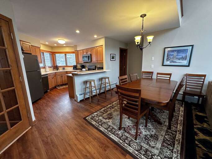 Dining table for 8 and breakfast bar in kitchen Dining table for 8 and breakfast bar in kitchen