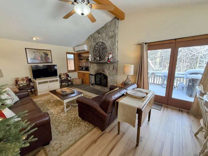 Dining/Living Area: Open concept space offers dining table with room for 8 and comfortable couches to relax by the stone fireplace. TV with high speed wi-fi included.