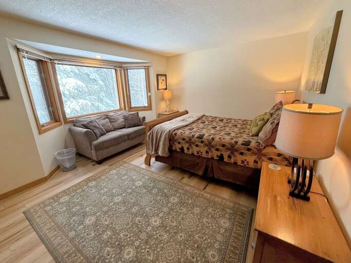 Guest Room #1: Located on the main level and features a queen bed and large closet. Shared bath across the hall. Sleeps 2.