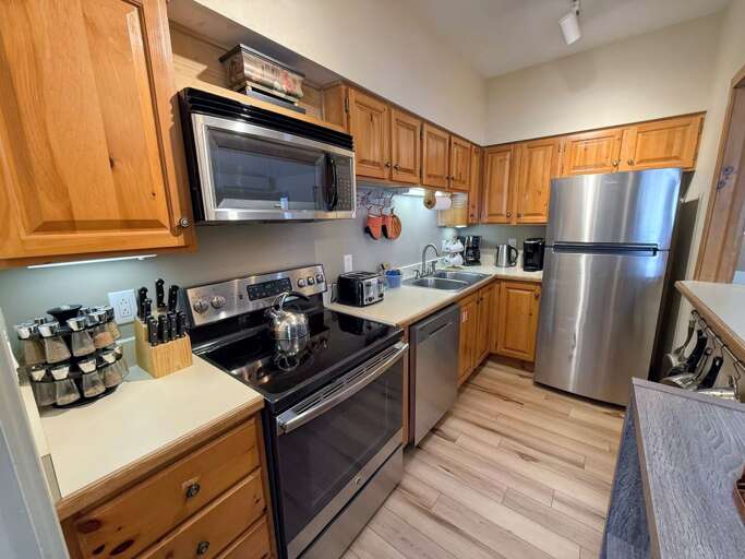 Kitchen: Fully stocked for all your cooking needs including drip coffee maker, Keurig and stainless steel appliances.