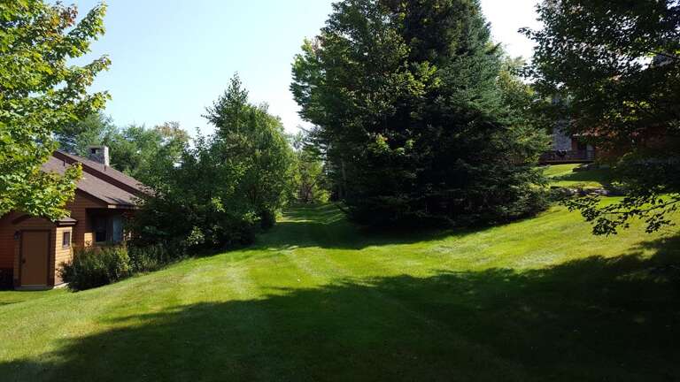 Outdoor Space: Step off the large deck, with a grill and outdoor dining, onto the the private