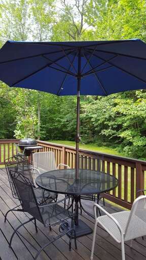 Outdoor Space: Step off the large deck, with a grill and outdoor dining, onto the the private