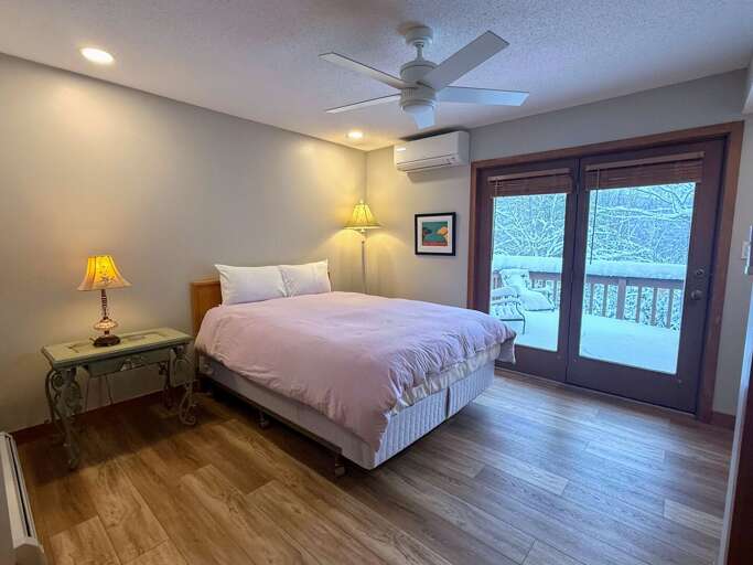 Queen Bedroom on the Main Level with Ensuite Bath and Private Deck