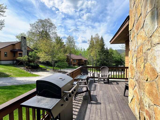 Residential Deck With Barbecue Grill And Outdoor Furniture
