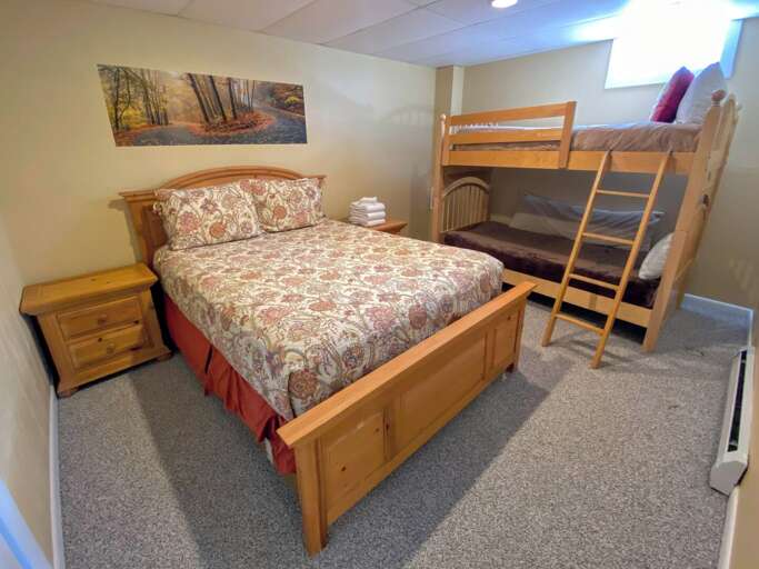 Guest Bedroom #2: Located on the lower level and features 1 queen sized bed and 1 standard bunk bed. Sleeps 4.