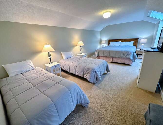 Loft Bedroom #2: Located on the upper level and features a King size bed and two twin beds. Sleeps 4. Loft Bedroom #2: Located on the upper level and features a King size bed and two twin beds. Sleeps 4.