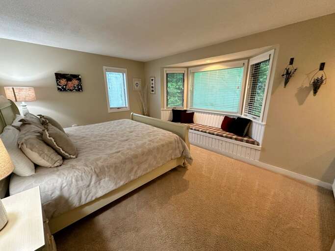 Main level bedroom with King bed and shared full bath across the hall Main level bedroom with King bed and shared full bath across the hall