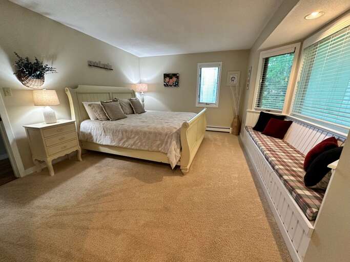Main level bedroom with King bed and shared full bath across the hall Main level bedroom with King bed and shared full bath across the hall