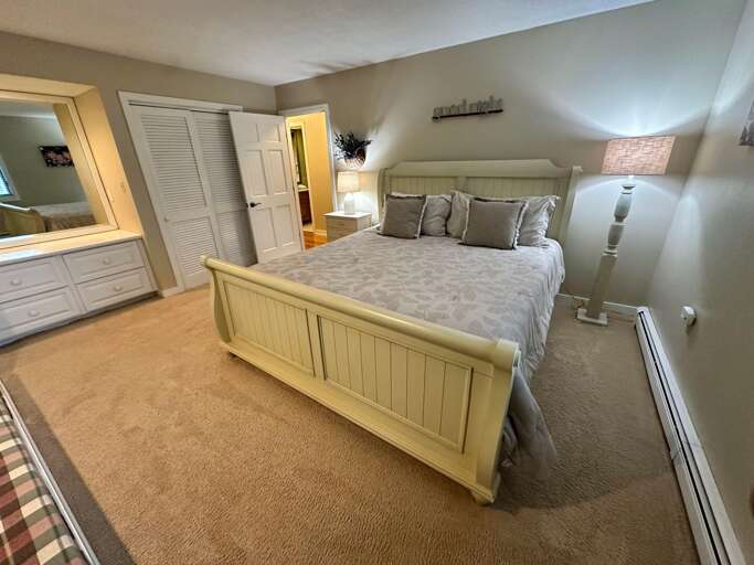 Main level bedroom with King bed and shared full bath across the hall Main level bedroom with King bed and shared full bath across the hall