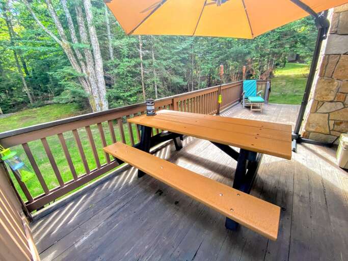 Outdoor Space: Nestled next to Bretton Woods Resort the ski slopes are a short walk from the house! A lovely deck offer a grill and provides outdoor dining as well!