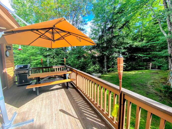 Outdoor Space: Nestled next to Bretton Woods Resort the ski slopes are a short walk from the house! A lovely deck offer a grill and provides outdoor dining as well!