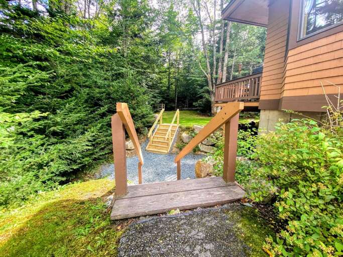 Outdoor Space: Nestled next to Bretton Woods Resort the ski slopes are a short walk from the house! A lovely deck offer a grill and provides outdoor dining as well!