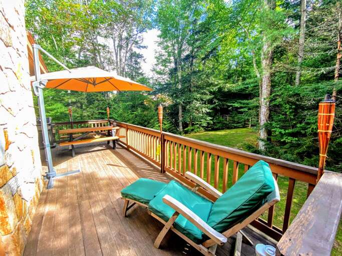 Outdoor Space: Nestled next to Bretton Woods Resort the ski slopes are a short walk from the house! A lovely deck offer a grill and provides outdoor dining as well!