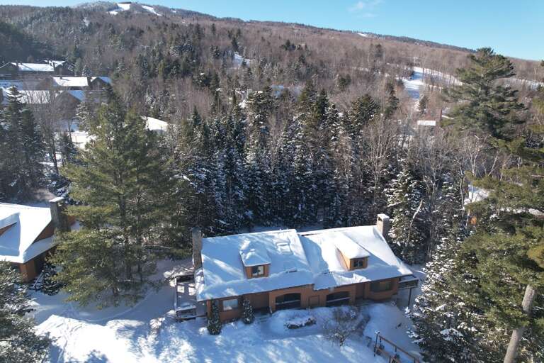 Just steps from the ski trails of Bretton Woods, this renovated Forest Cottage home is full of great luxury details, from heated boot racks to bed warmers!
