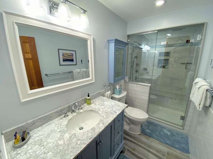 Upper level shared bathroom with luxury steam shower