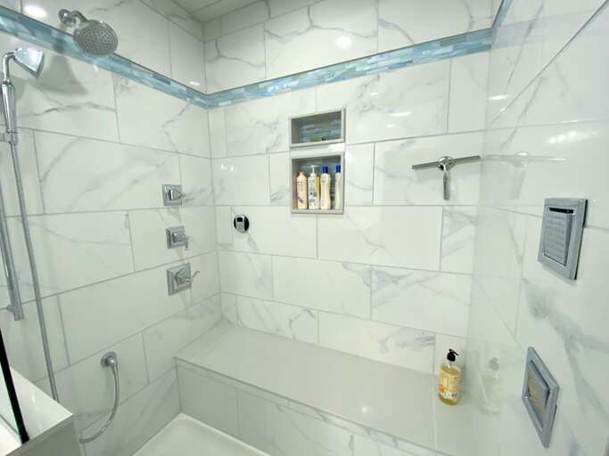 Upper level shared bathroom with luxury steam shower