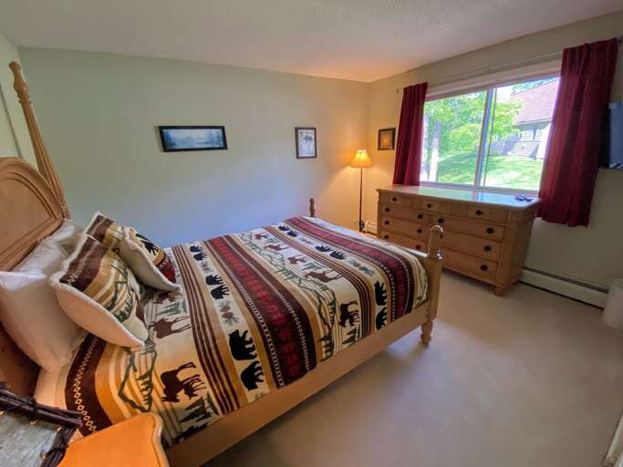 Guest Bedroom #1 is located on the main level and features a Queen bed and TV. Sleeps 2.