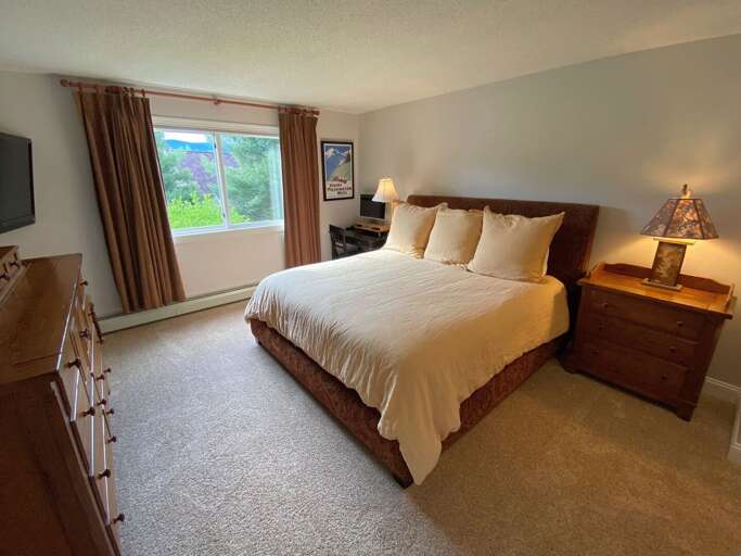 Master Bedroom is located on the main level and features a King sized bed and TV. Sleeps 2.
