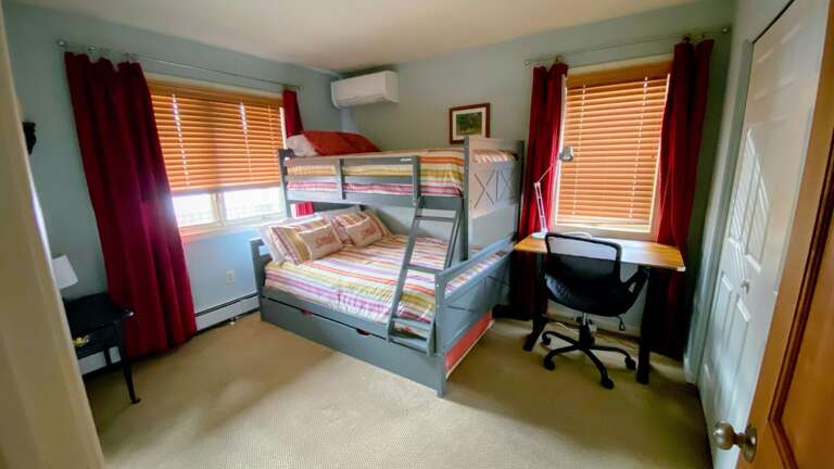 Bedroom with Twin-over-Full Bunk Bed and workspace