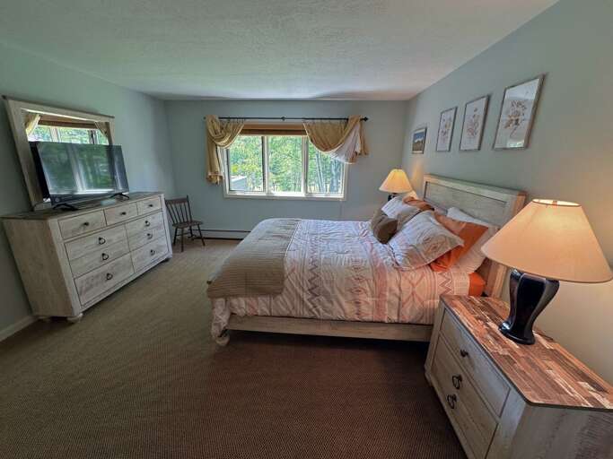 Queen bedroom with private bath and TV