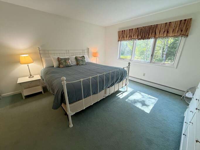 Primary Bedroom features a King size bed and attached bath. Sleeps 2.
